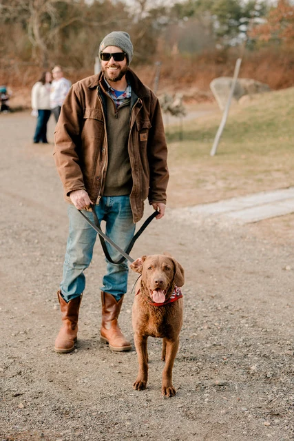 Cass Gilmore outdoors with his dog