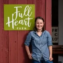 Allyson Angelini standing in front of a Full Heart Farm sign